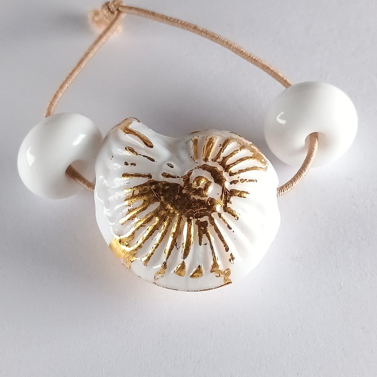 Small opal blue ammonite bead with gold leaf Jolene Beads