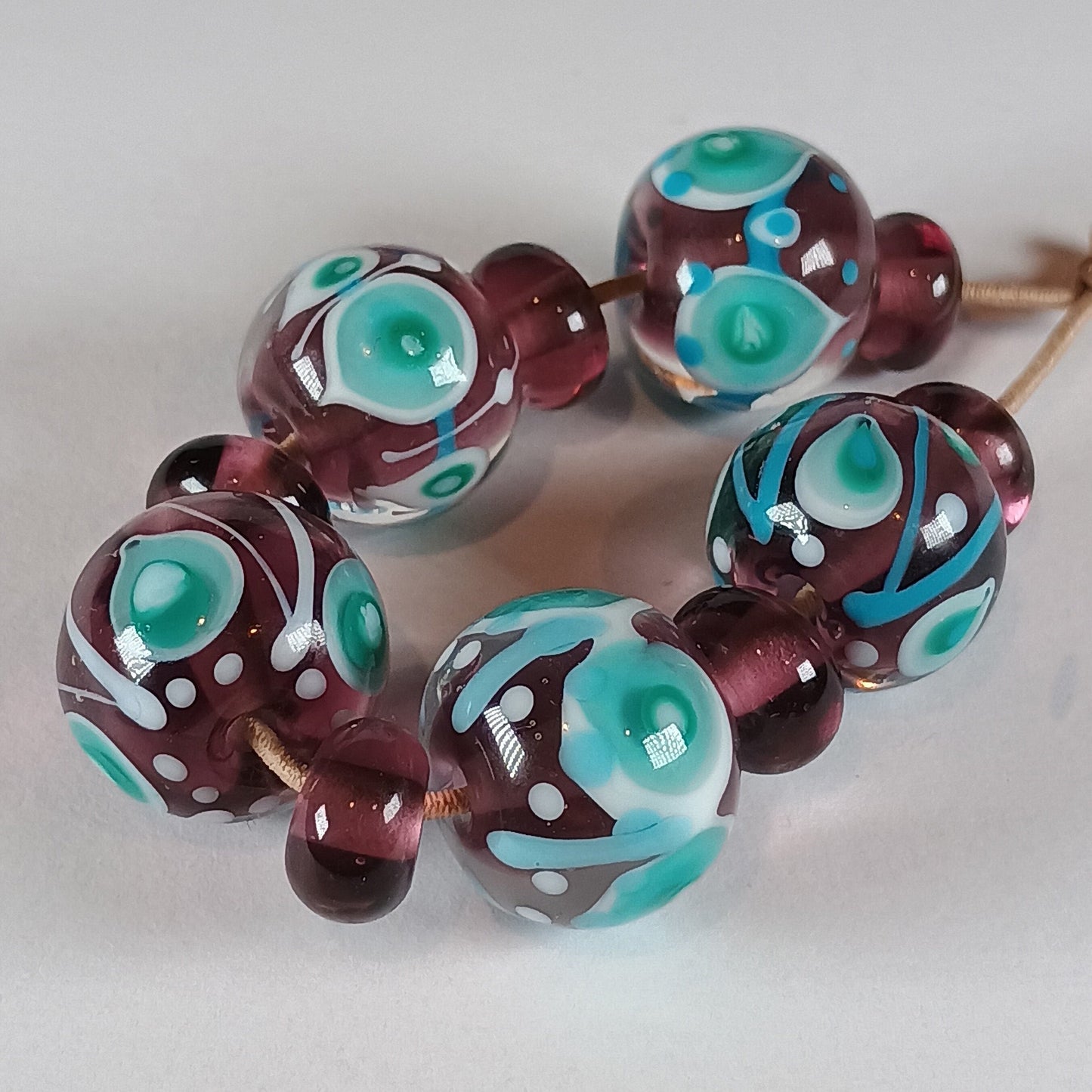 Purple, turquoise and white stacked dot lampwork glass bead set Jolene Beads