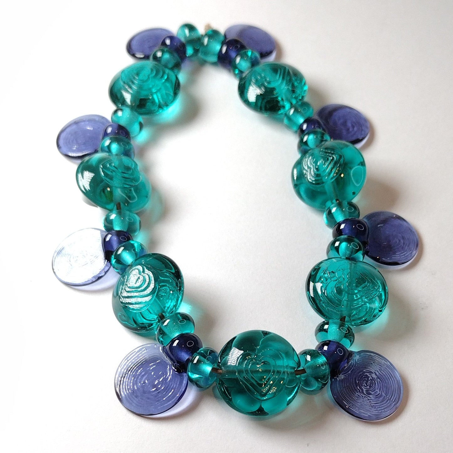 Large set of teal and purple daisy themed lampwork beads Jolene Beads