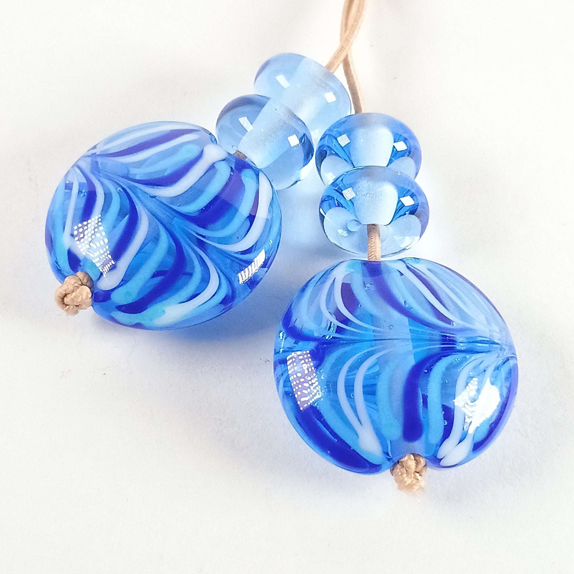 Pair of pale blue raked lampwork lentil beads Jolene Beads