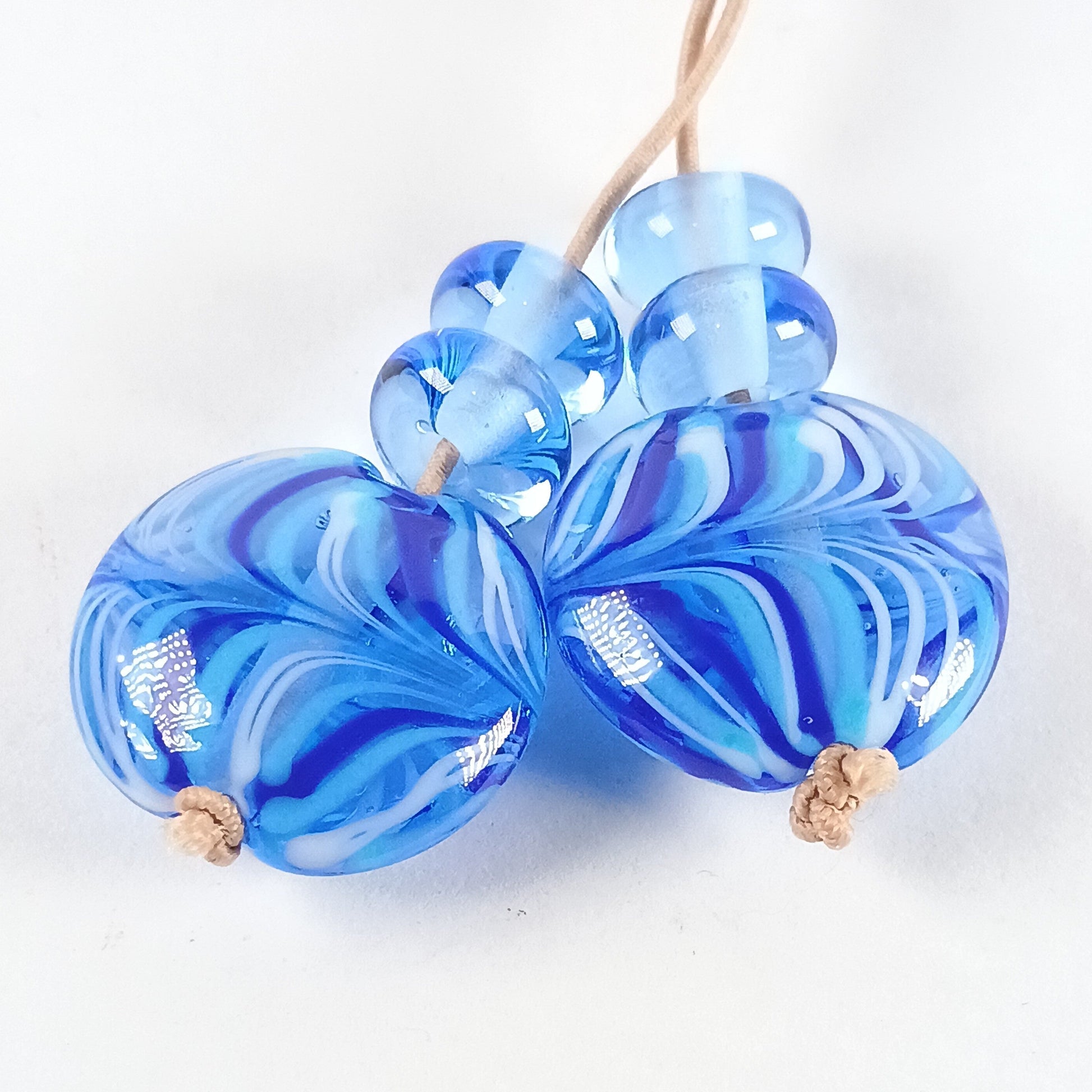 Pair of pale blue raked lampwork lentil beads Jolene Beads