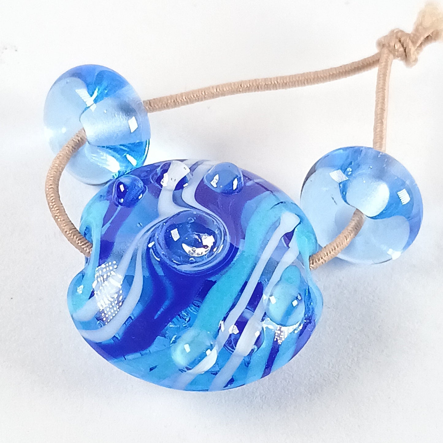 Pale blue 18mm raked lampwork lentil bead Jolene Beads