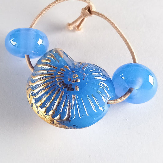 Small opal blue ammonite bead with gold leaf Jolene Beads