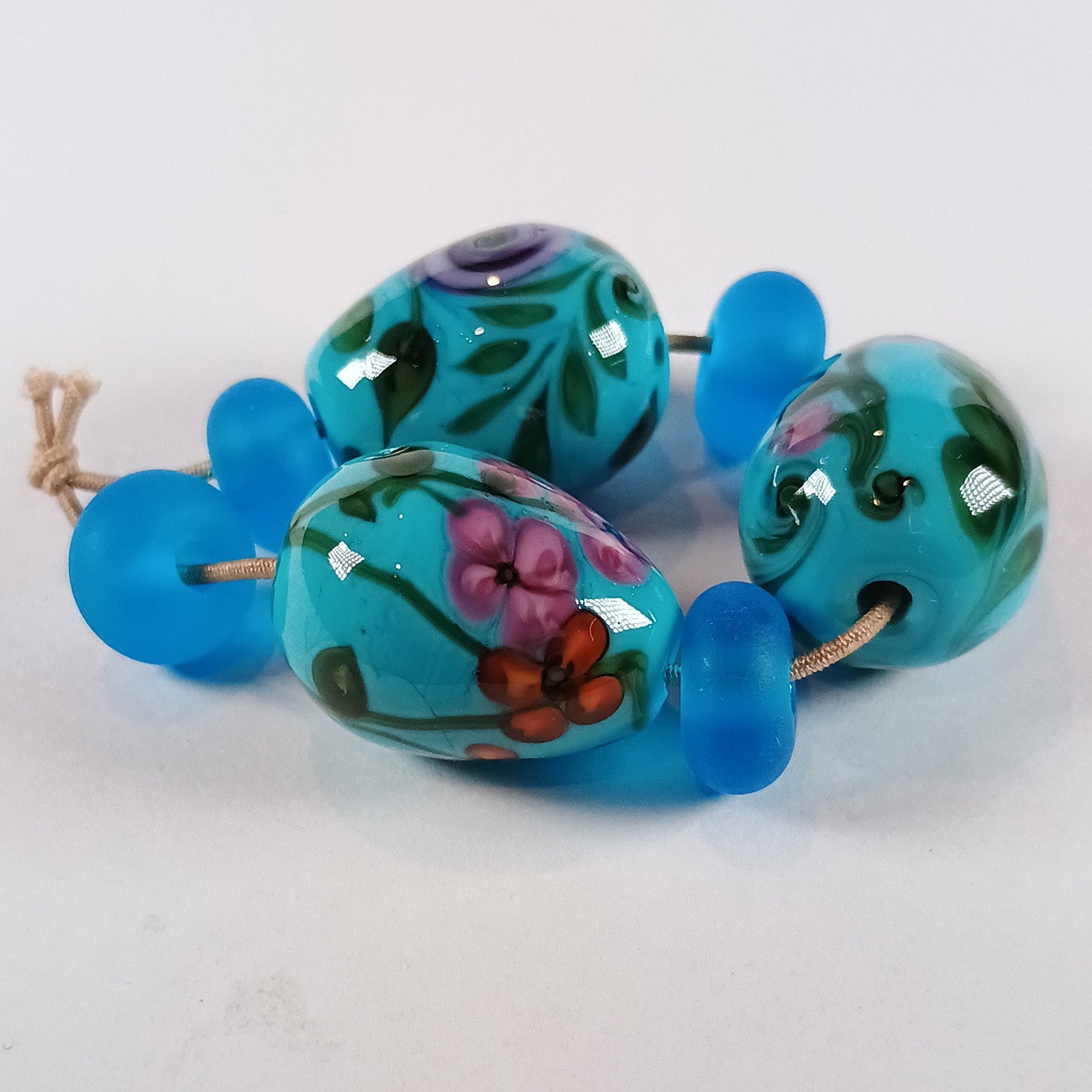 Turquoise floral egg bead trio with spacers Jolene Beads