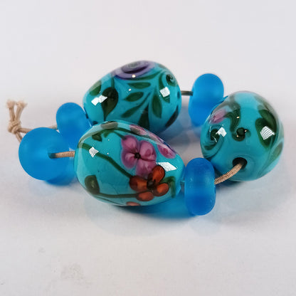 Turquoise floral egg bead trio with spacers Jolene Beads