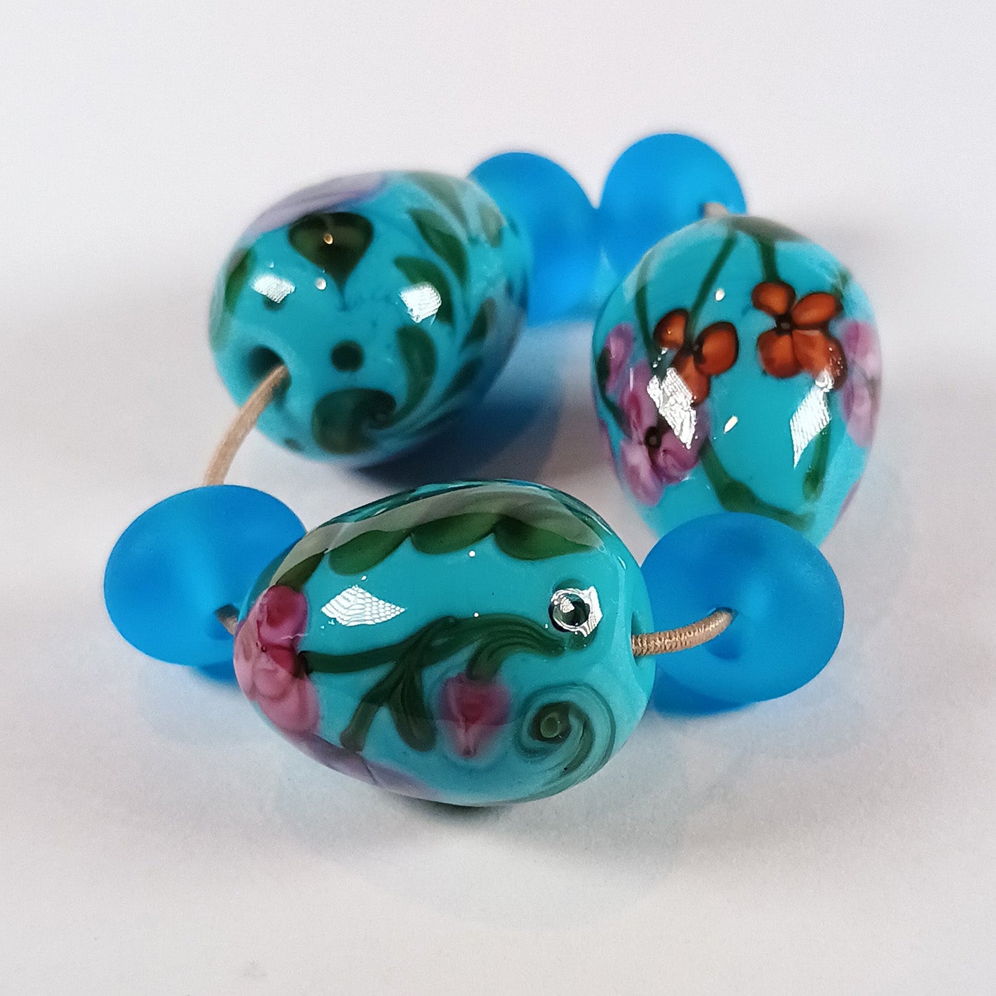 Turquoise floral egg bead trio with spacers Jolene Beads