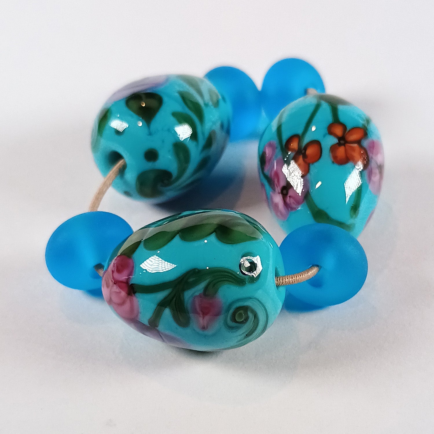 Turquoise floral egg bead trio with spacers Jolene Beads