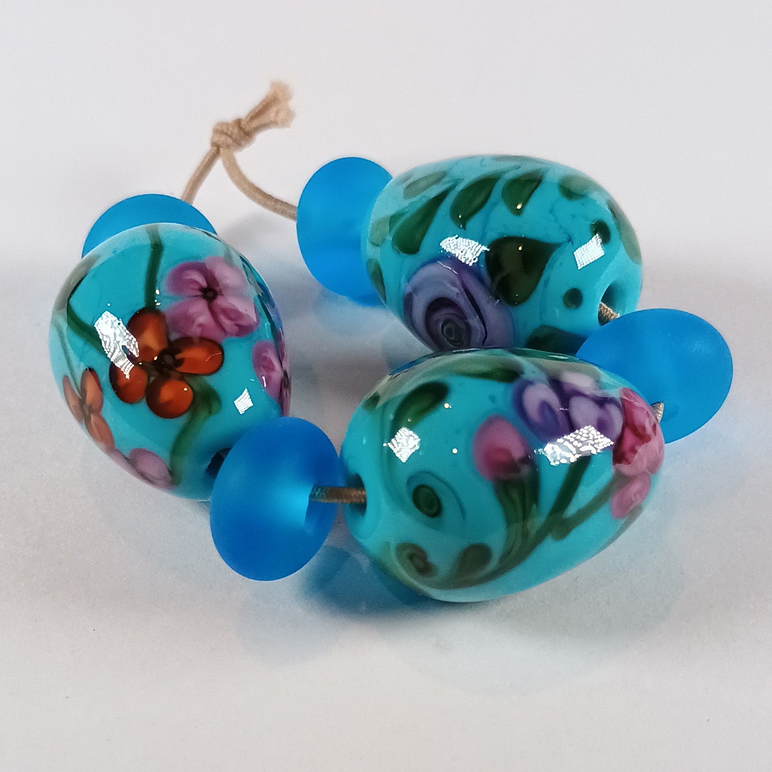 Turquoise floral egg bead trio with spacers Jolene Beads
