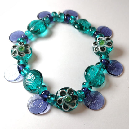 Large set of teal and purple daisy themed lampwork beads Jolene Beads