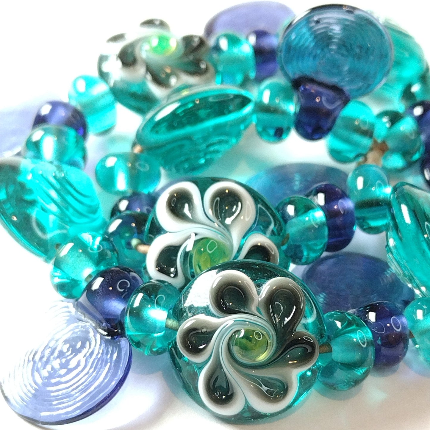 Large set of teal and purple daisy themed lampwork beads Jolene Beads