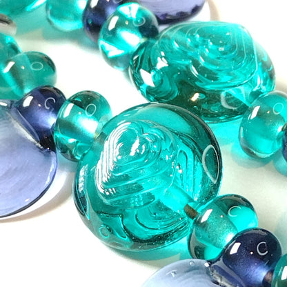Large set of teal and purple daisy themed lampwork beads Jolene Beads