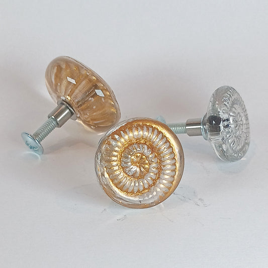 Clear glass ammonite drawer knobs in small, medium and large sizes