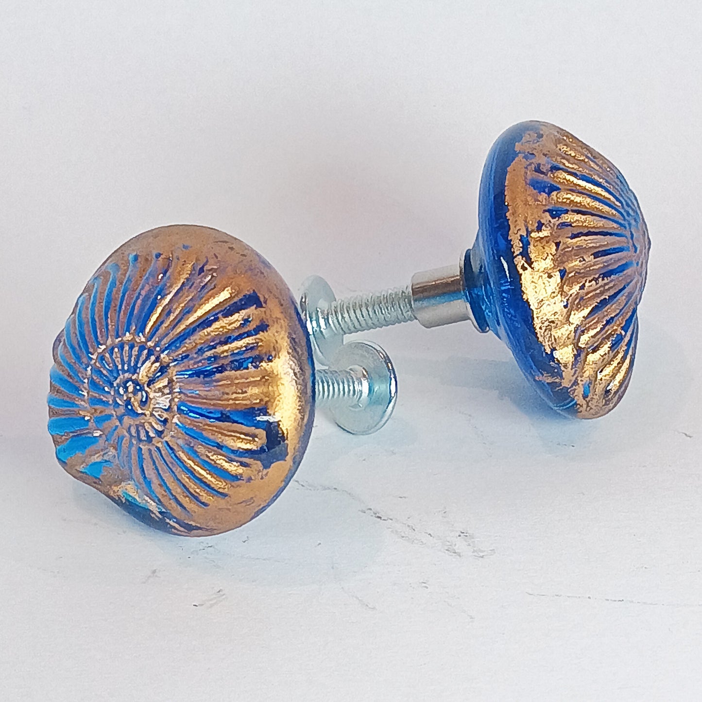 Pair of blue and gold decorative knobs with gold detail