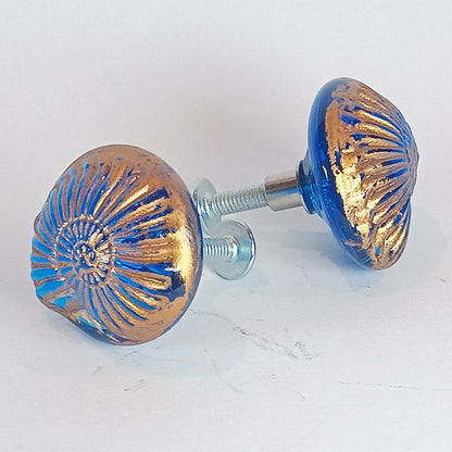 Pair of blue and gold decorative knobs with gold detail