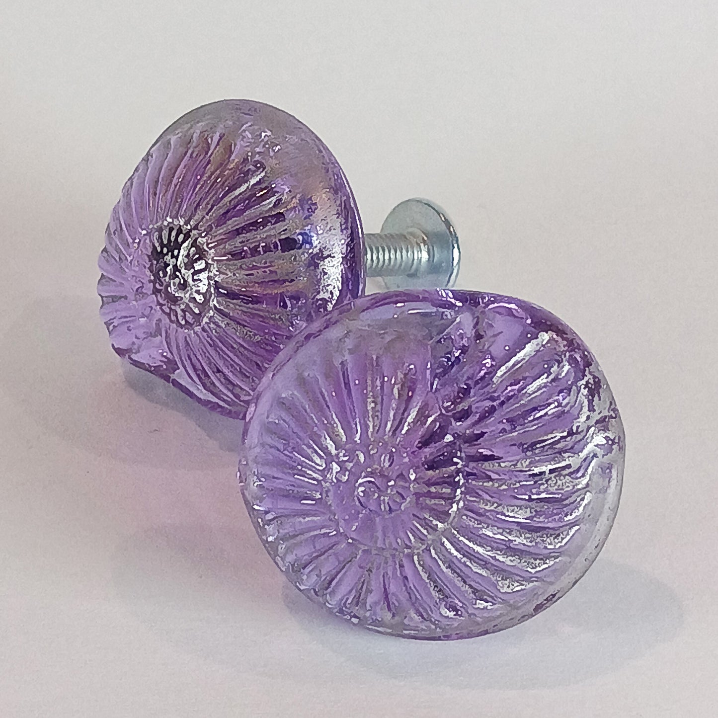 Two purple shell glass cabinet knobs 
