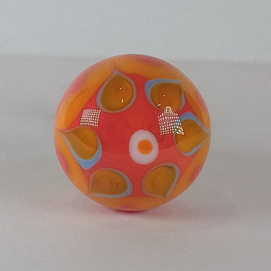 Decorative glass draw knob with orange and blue patterns