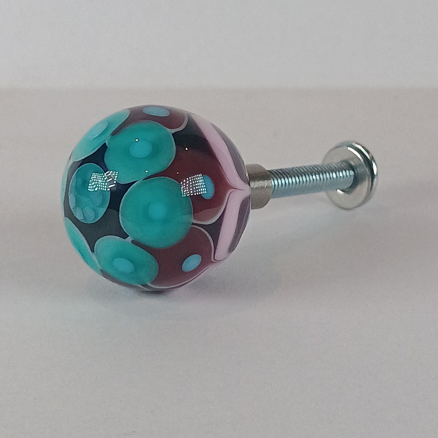 Purple, pink and teal stacked dot glass knob