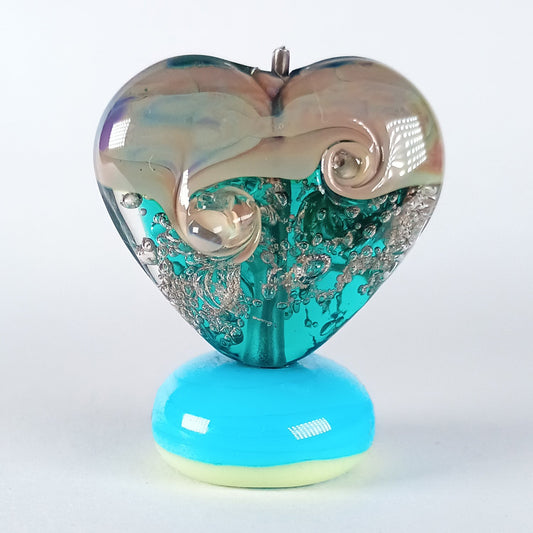 Heart-shaped lampwork bead with teal base and raku top 