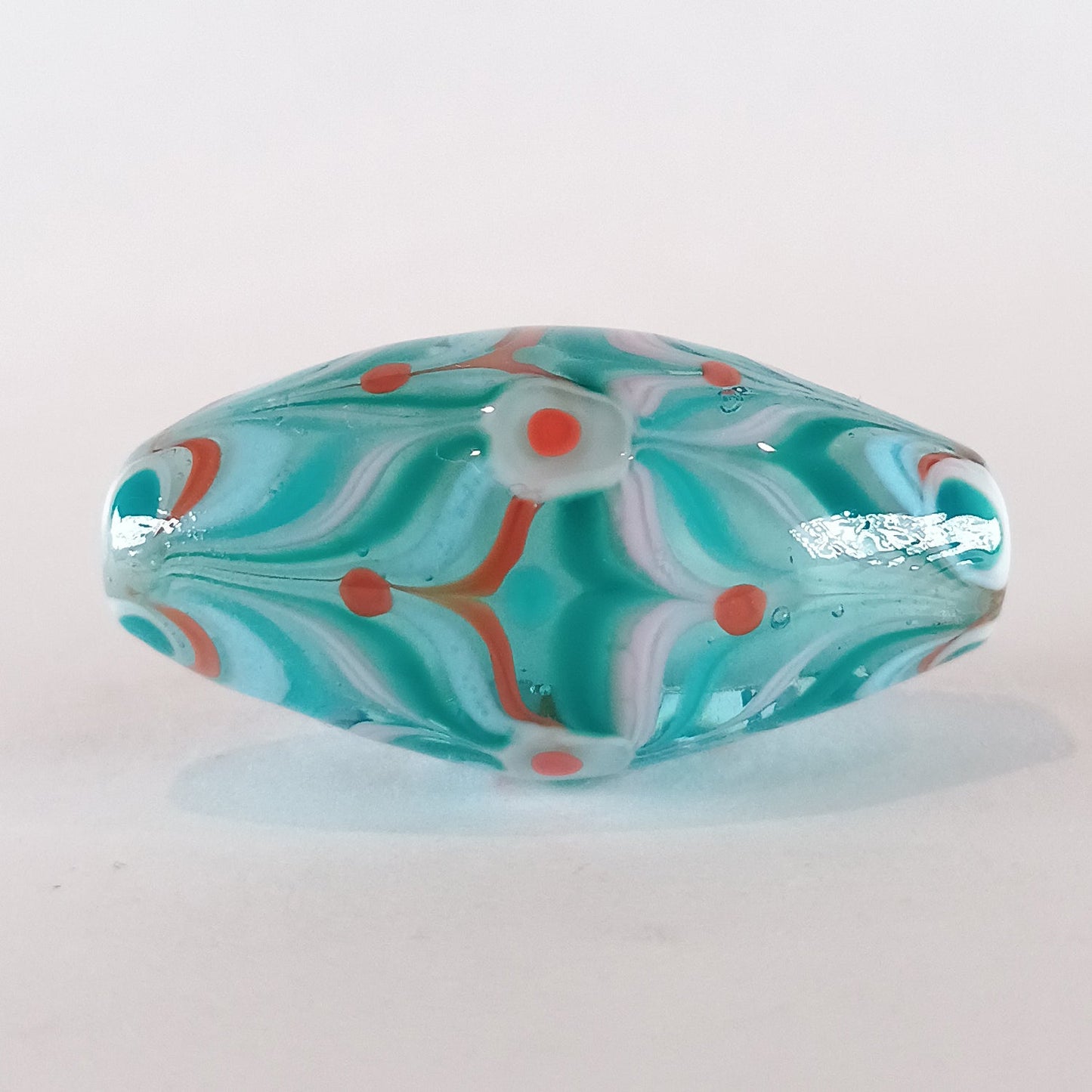 Encased pale blue raked bicone lampwork focal bead Jolene Beads