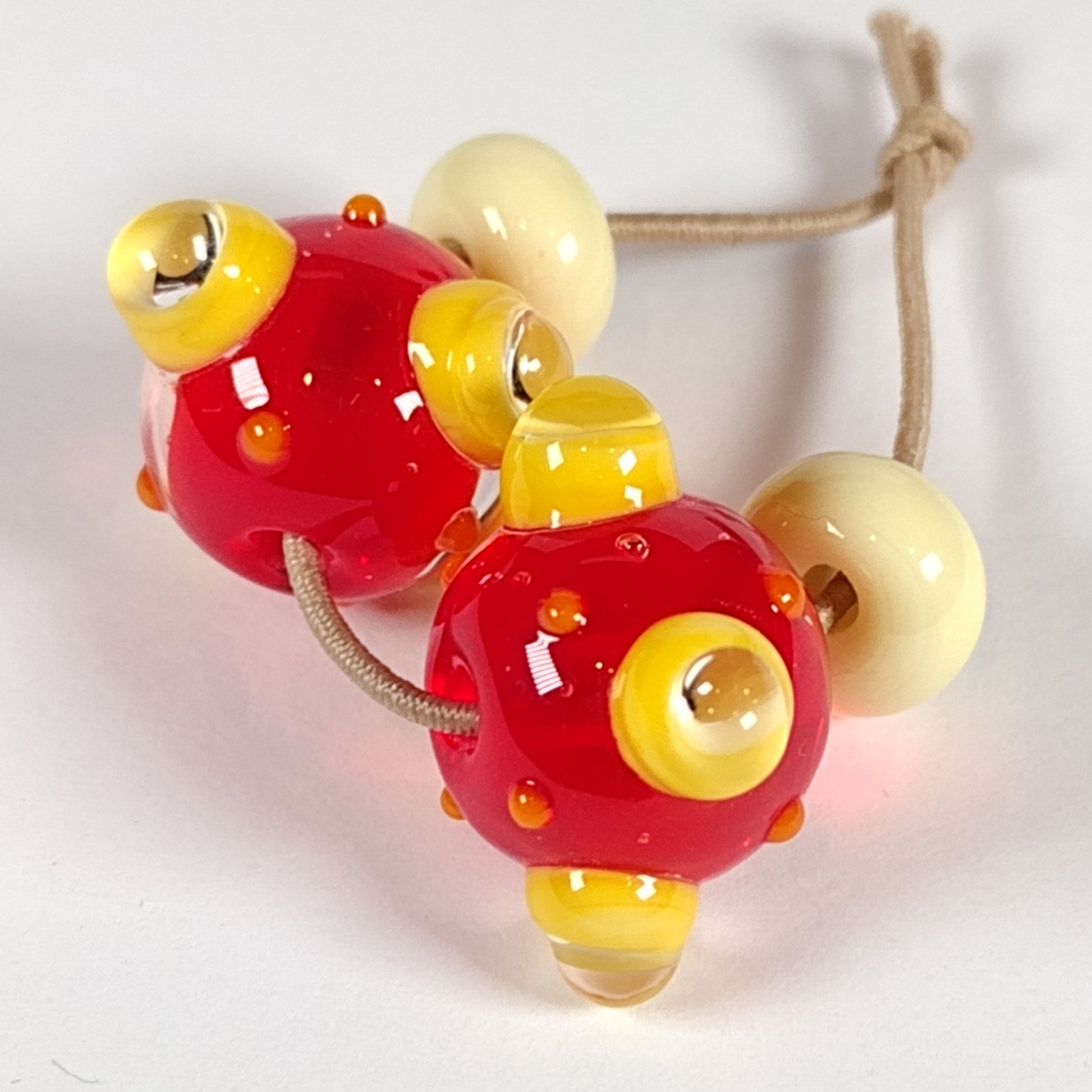 Orange bumpy lampwork bead pair Jolene Beads