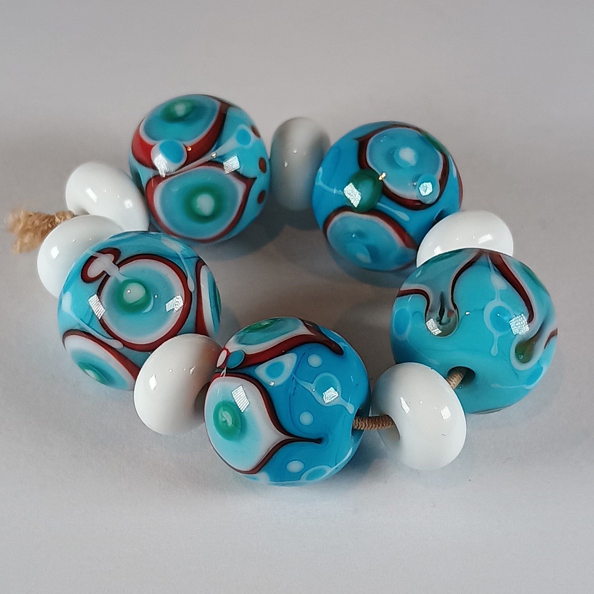 Turquoise stacked dot bead set with white and red detail Jolene Beads