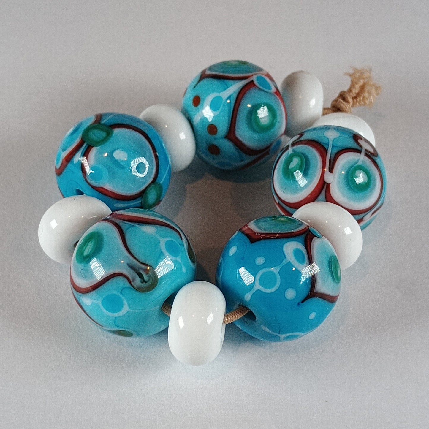 Turquoise stacked dot bead set with white and red detail Jolene Beads