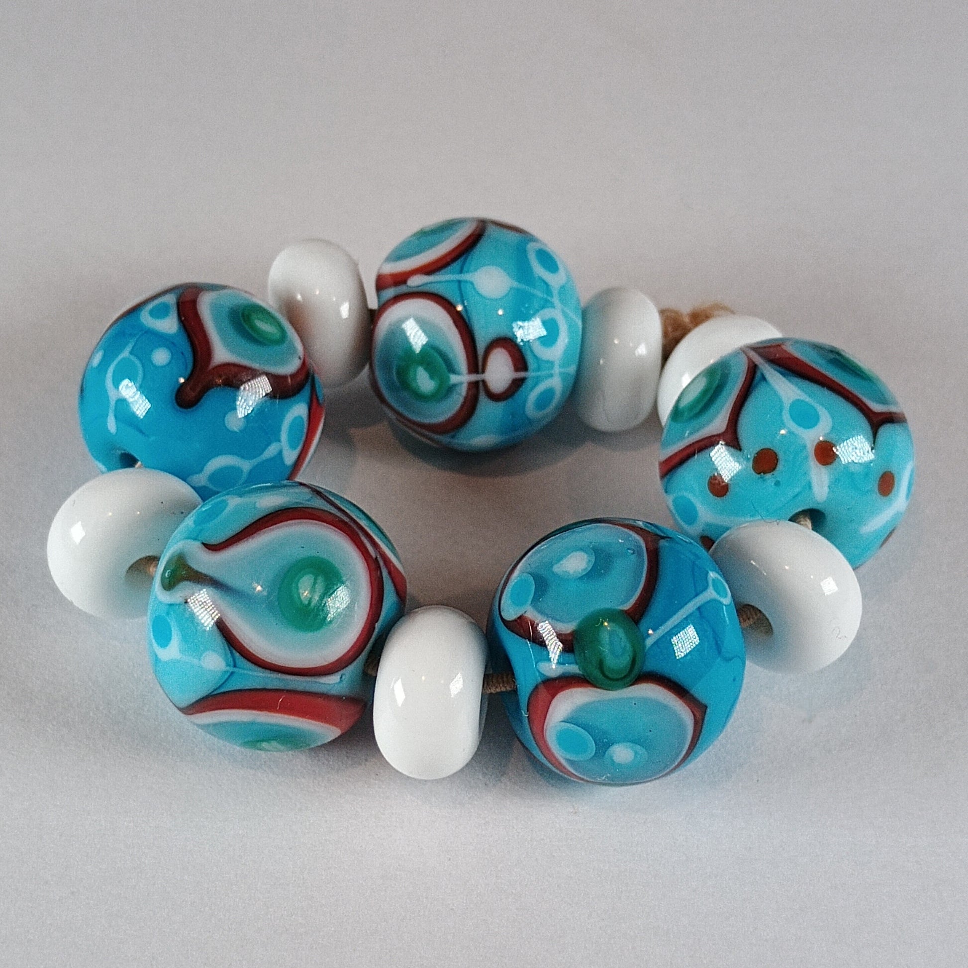 Turquoise stacked dot bead set with white and red detail Jolene Beads